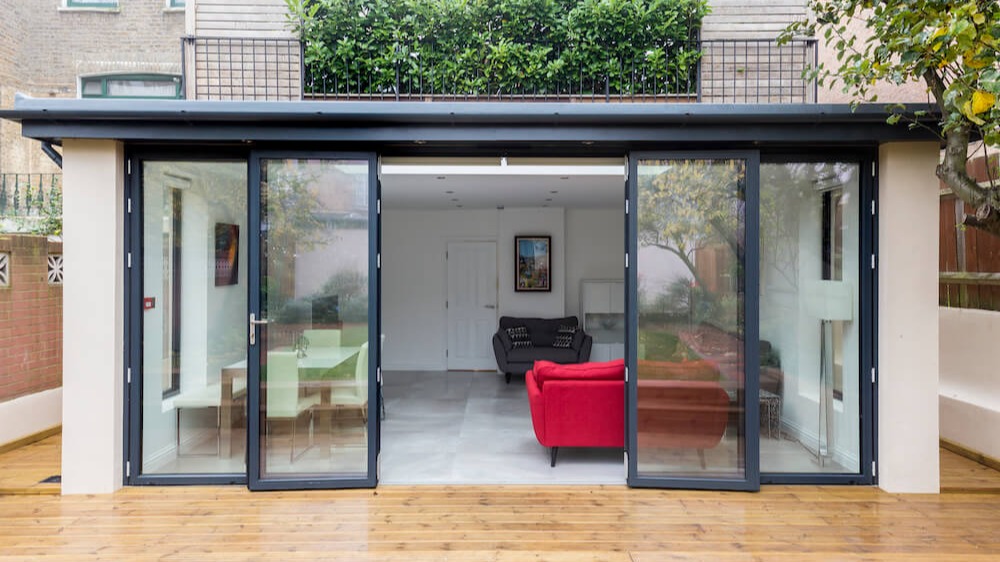 Modern garden room blending indoor and outdoor living spaces beautifully.