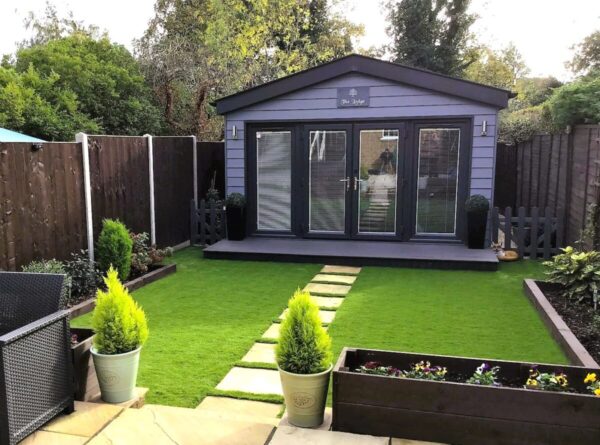 Modern granny annexe in a well-manicured suburban garden.