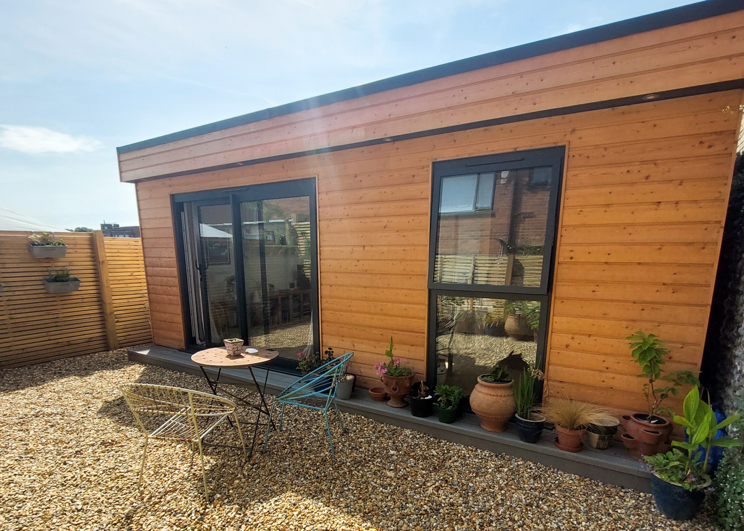 Modern granny annexe with patio, ideal for teenage living space.