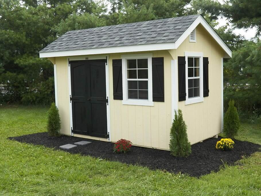 Compact granny annexe with charming landscaping and lush greenery.