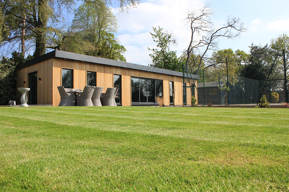Modern granny annexe blending seamlessly into a spacious garden.