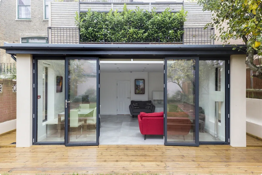Modern granny annexe with large windows and stylish interior.