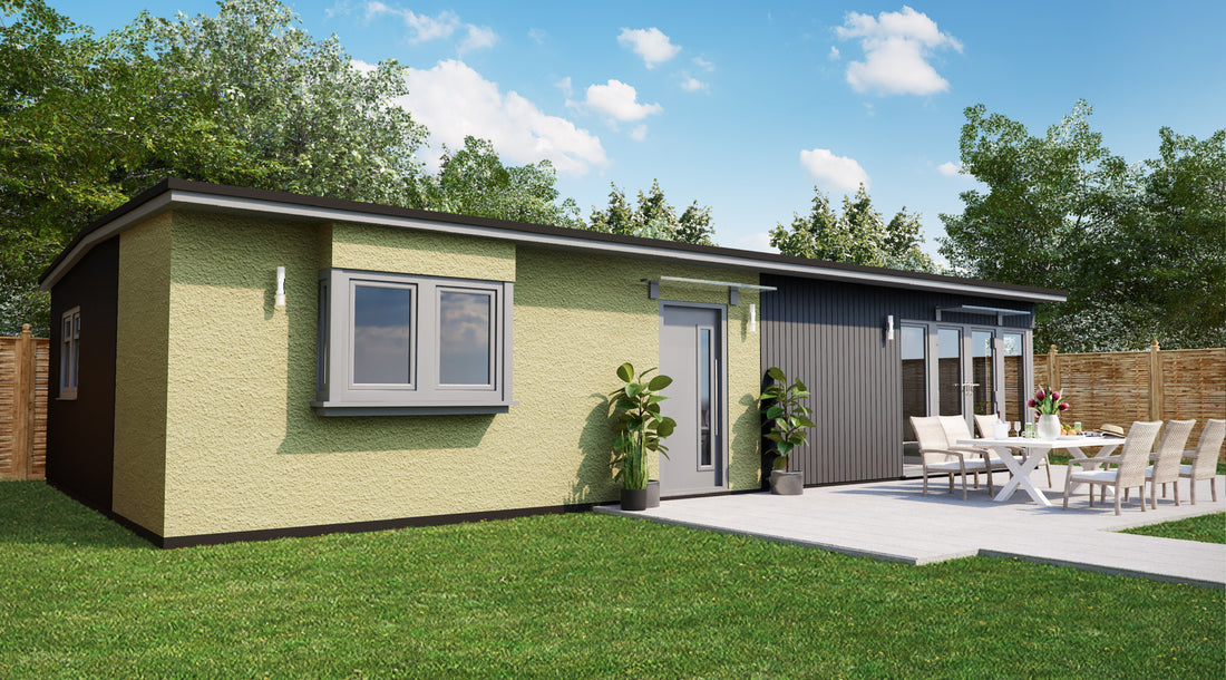 Modern granny annexe with outdoor dining area and lush garden.