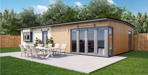 Modern granny annexe with spacious outdoor seating area.