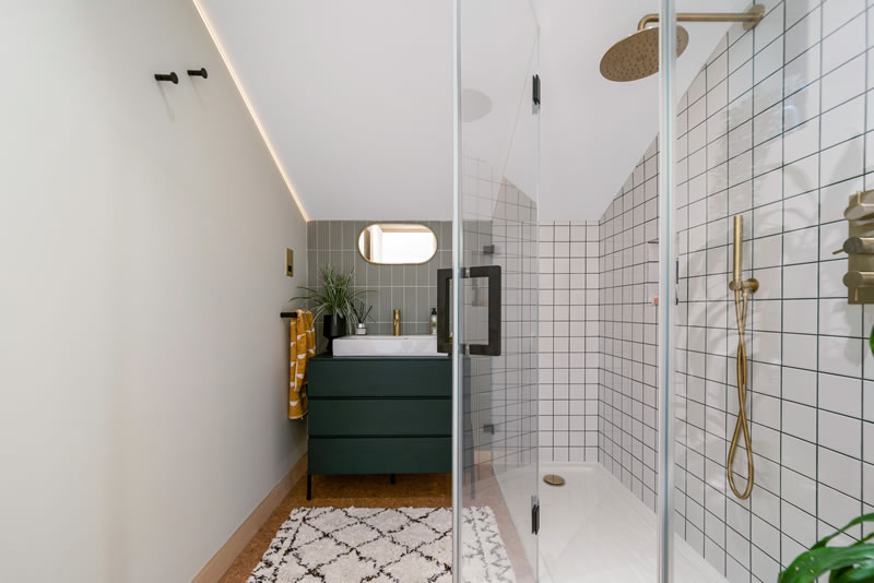 Modern, stylish granny annexe bathroom with elegant fixtures and lighting.